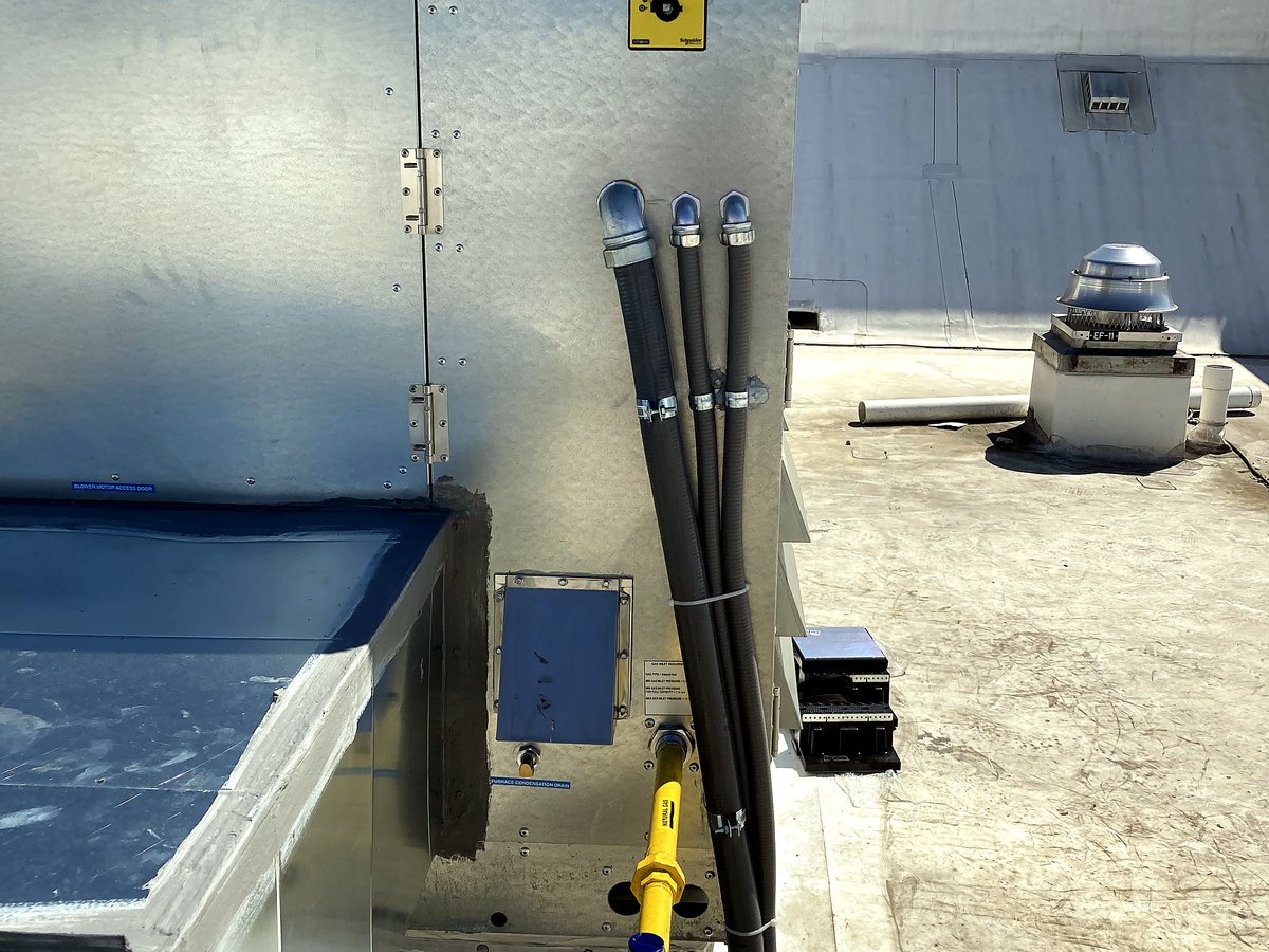 Rooftop conduit entry point with junction box