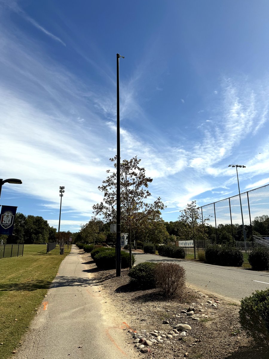 New tall light pole installation at a recreational field